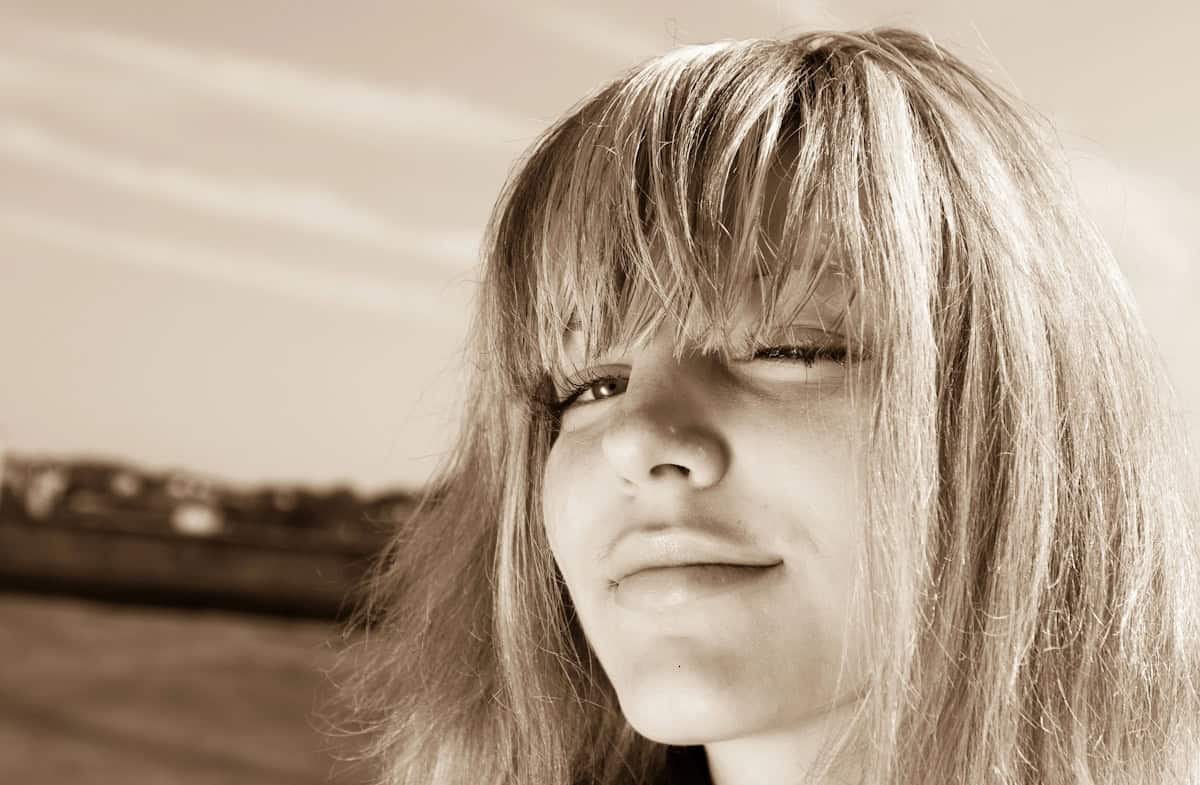 photo of young woman looking into camera